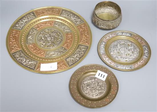 A mixed metalware set of Indian plates and a bowl